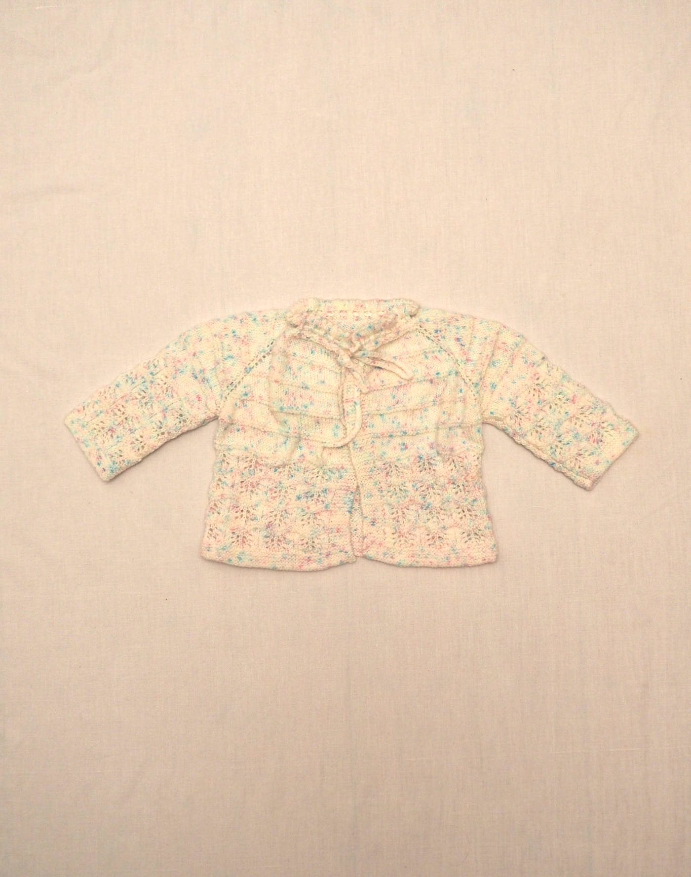 Gilet tricoté main chiné rose