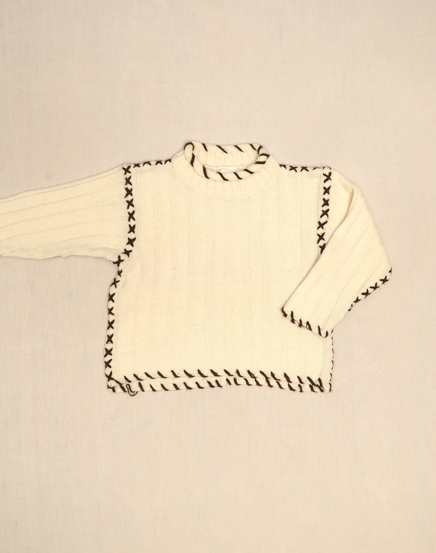 Pullover with stitched seams