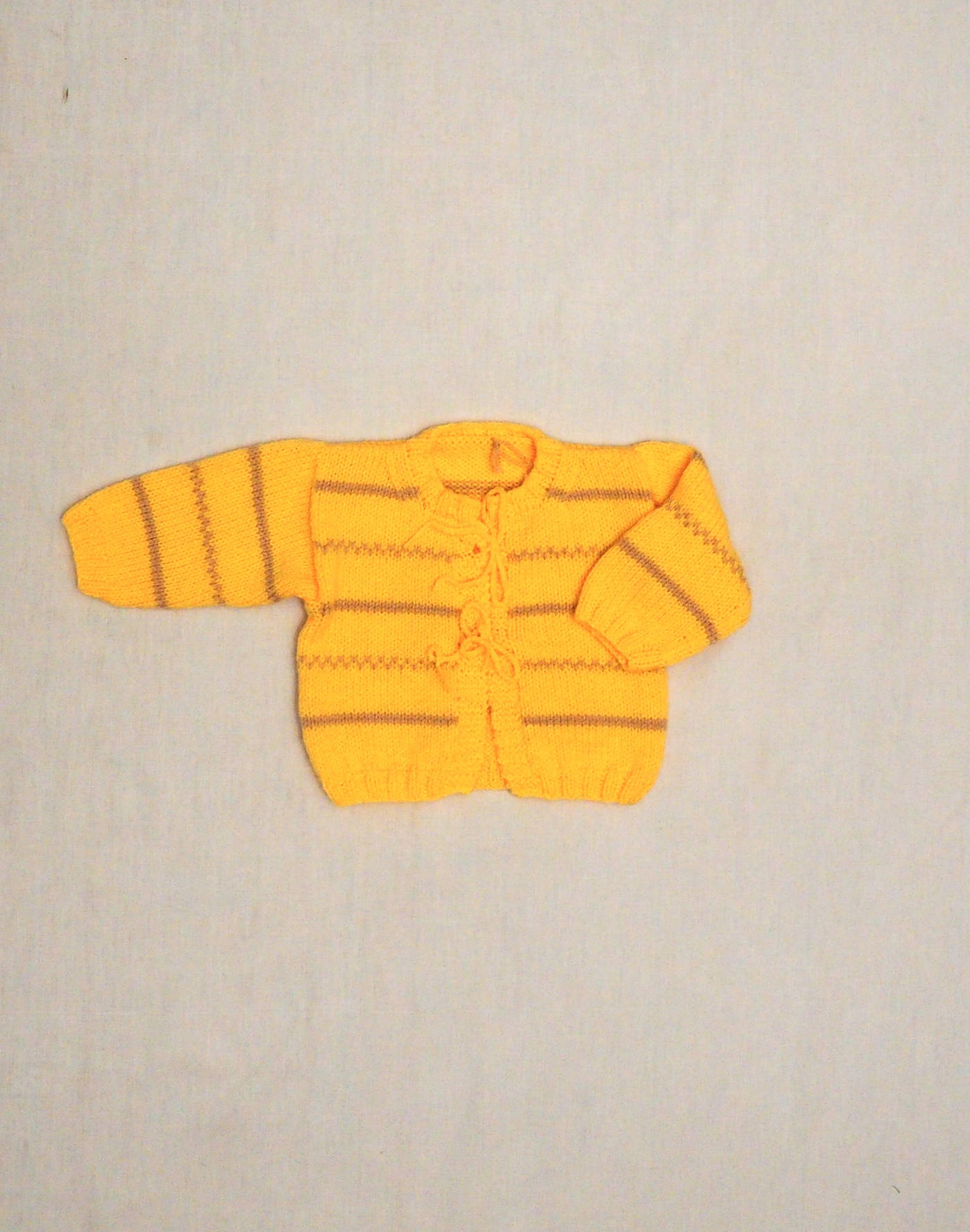 Cardigan tricoté main à nouer