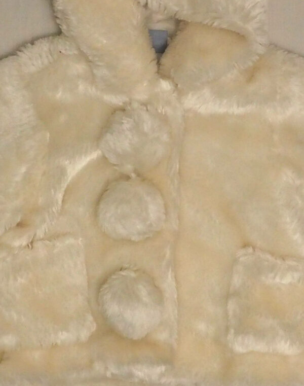 Faux fur coat with tassels