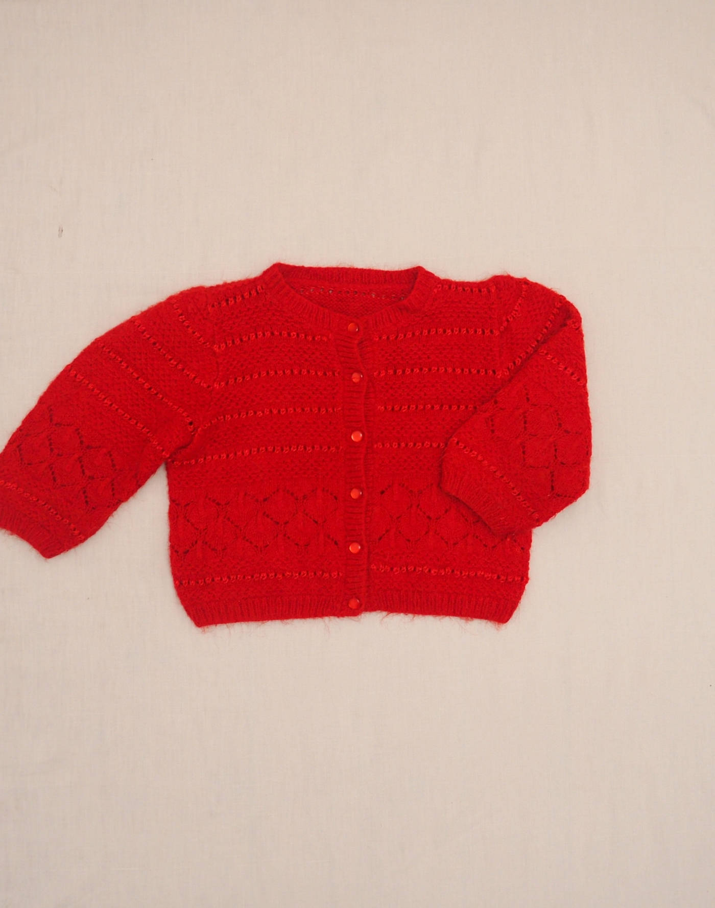 Hand-knitted red cardigan