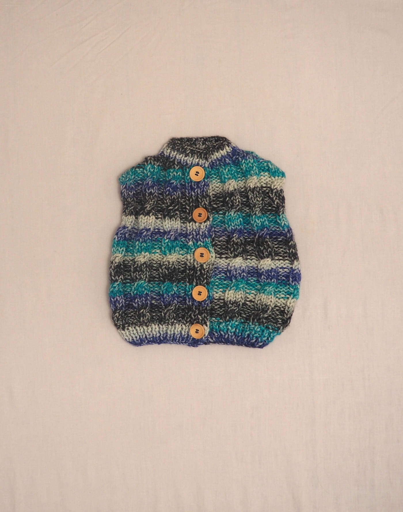 Hand-knitted sleeveless cardigan