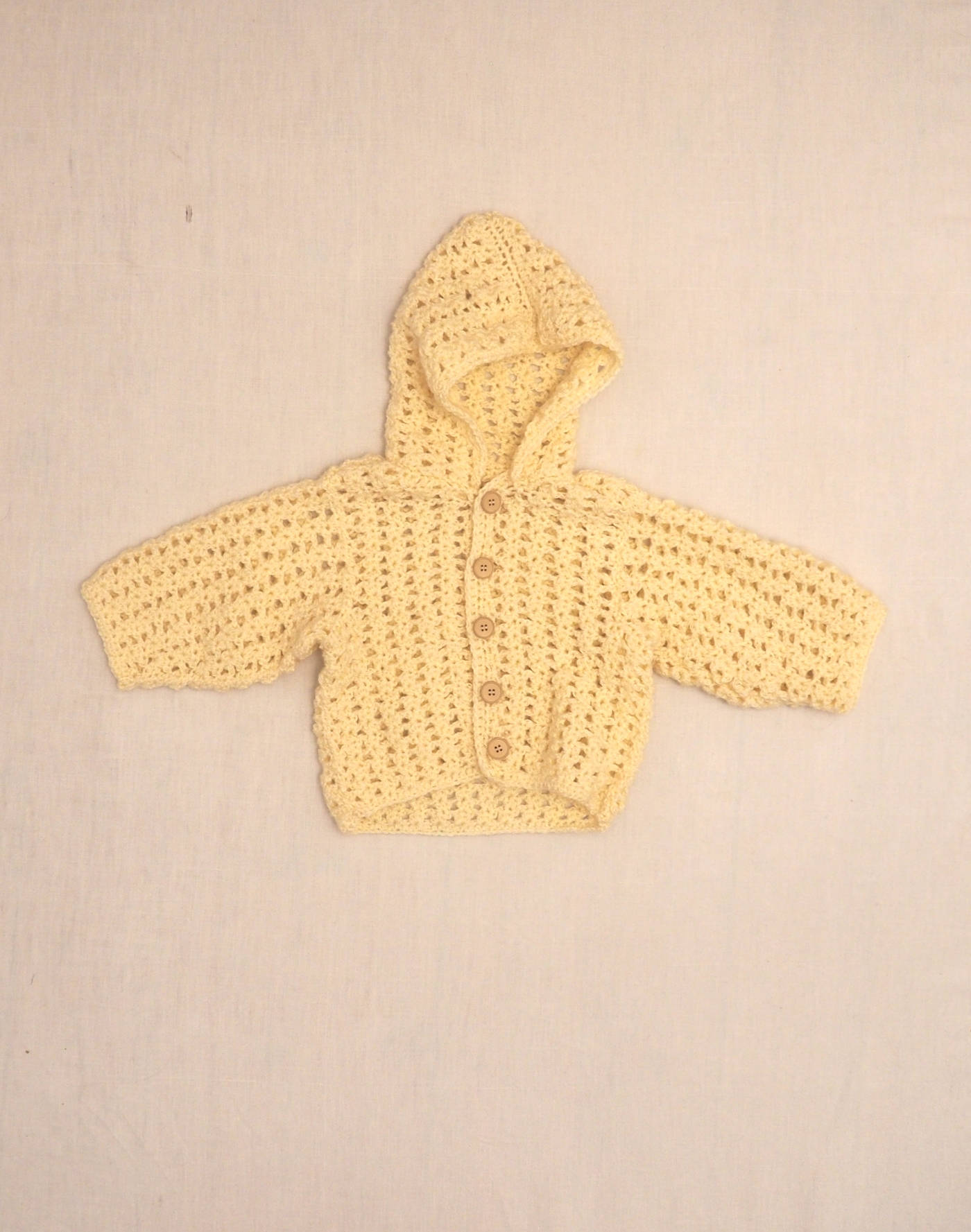 Hand-knitted hooded vest