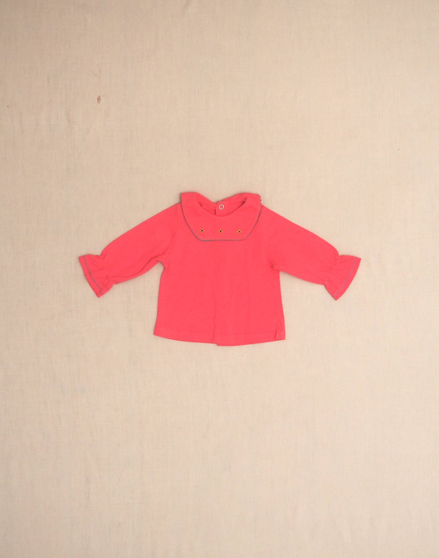 Jersey blouse with embroidered collar