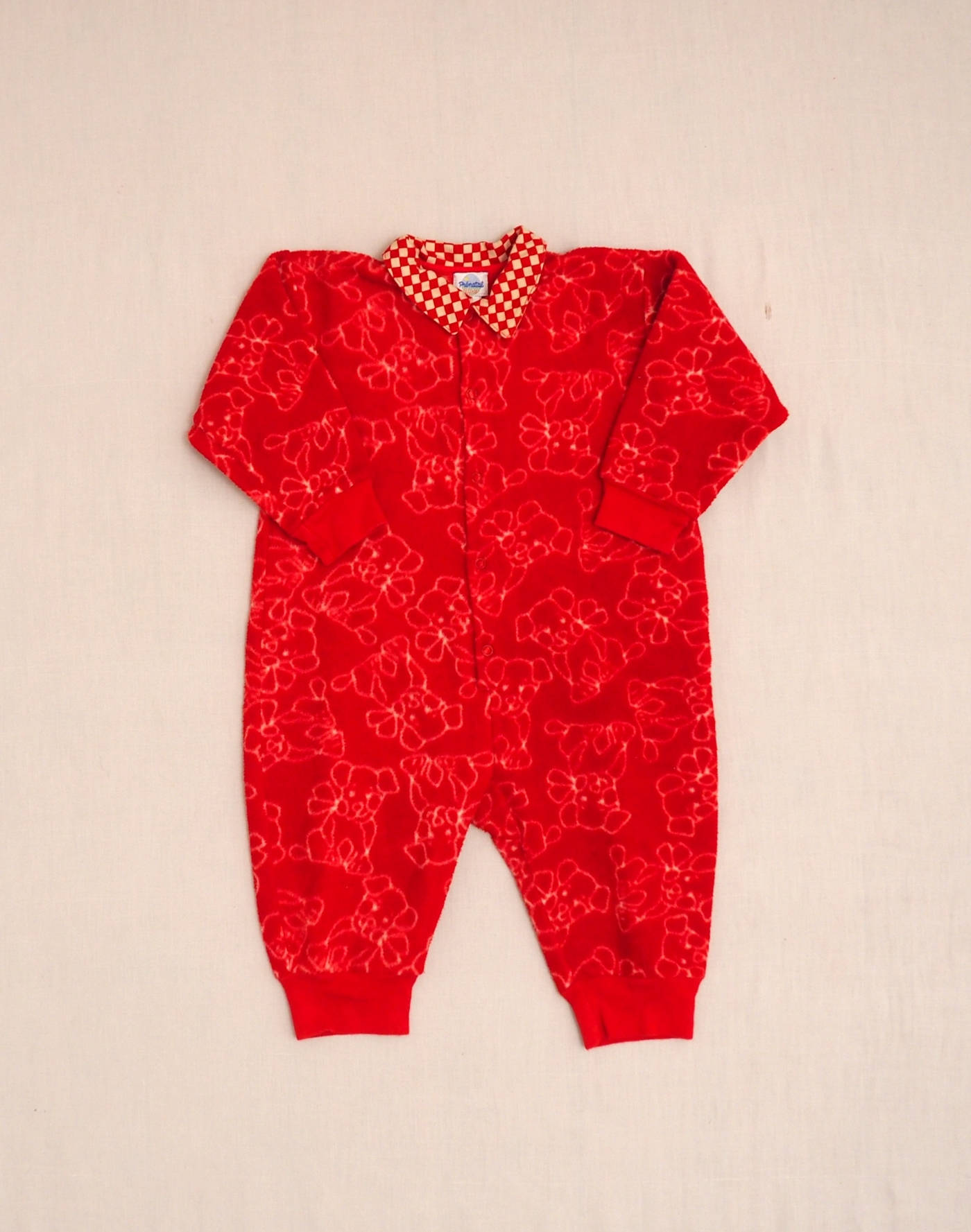 Fleece romper with dog motif