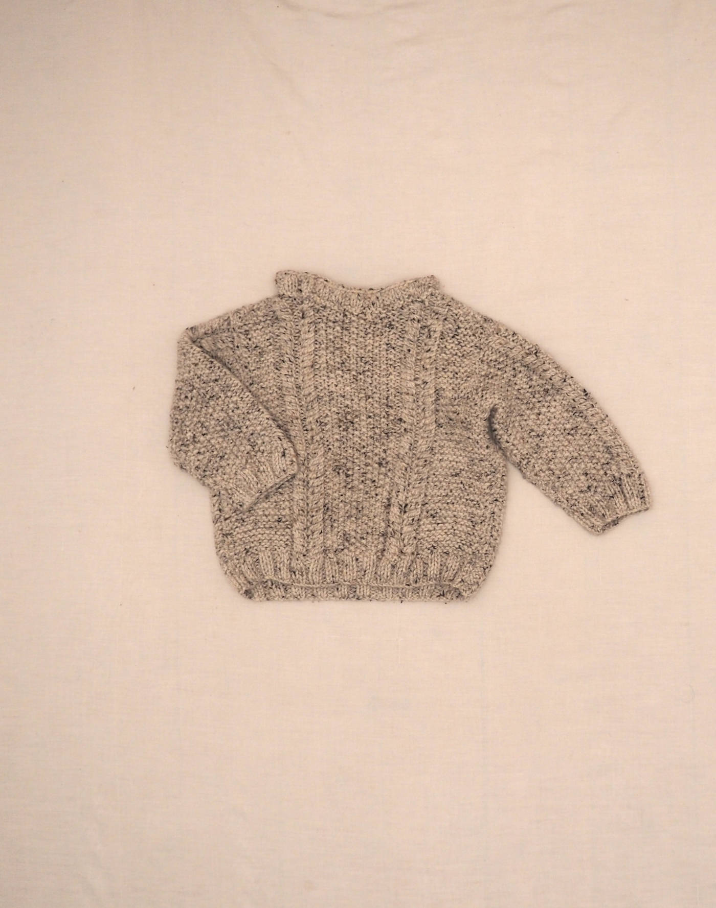 Hand-knitted mottled sweater