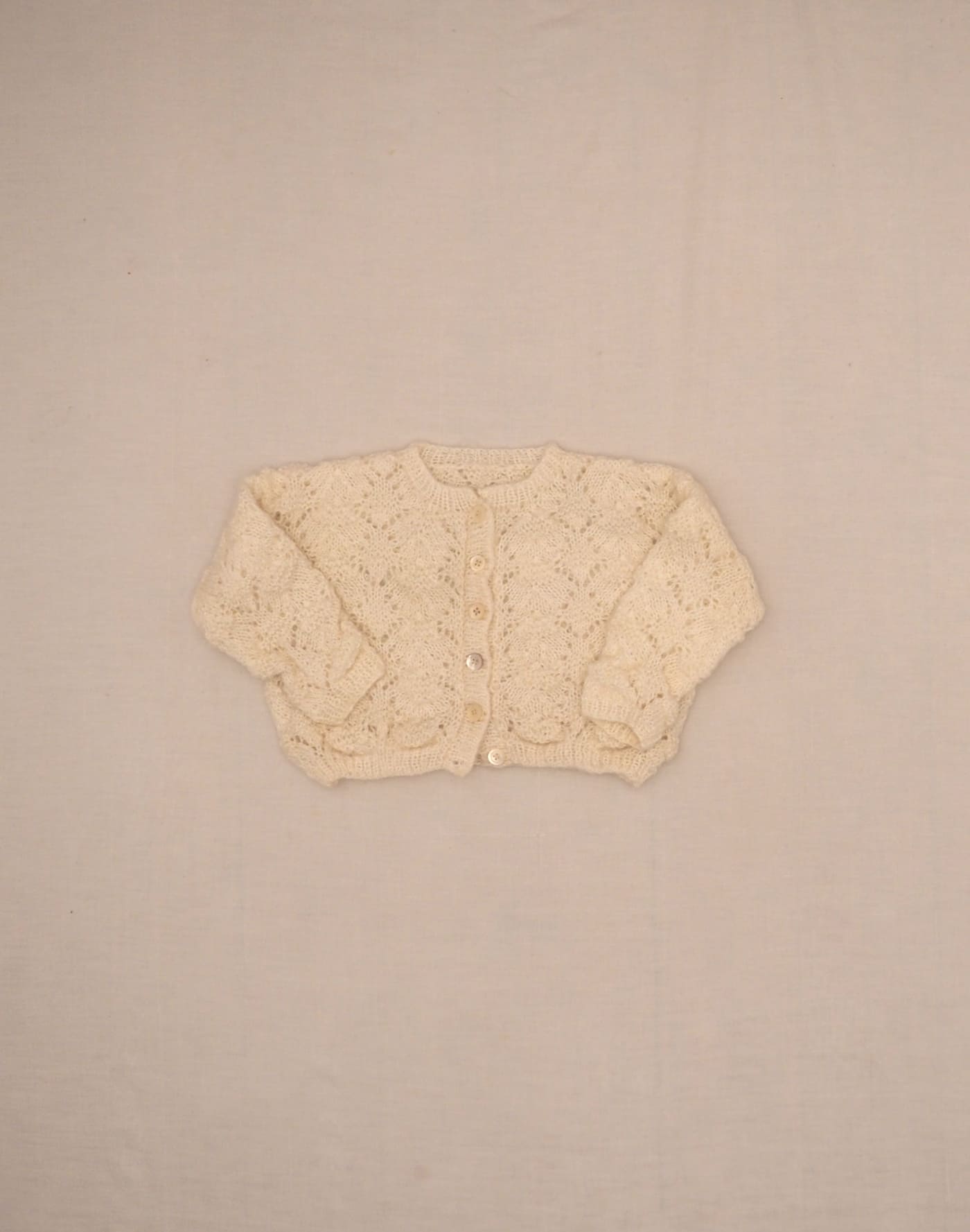 Openwork hand-knit cardigan