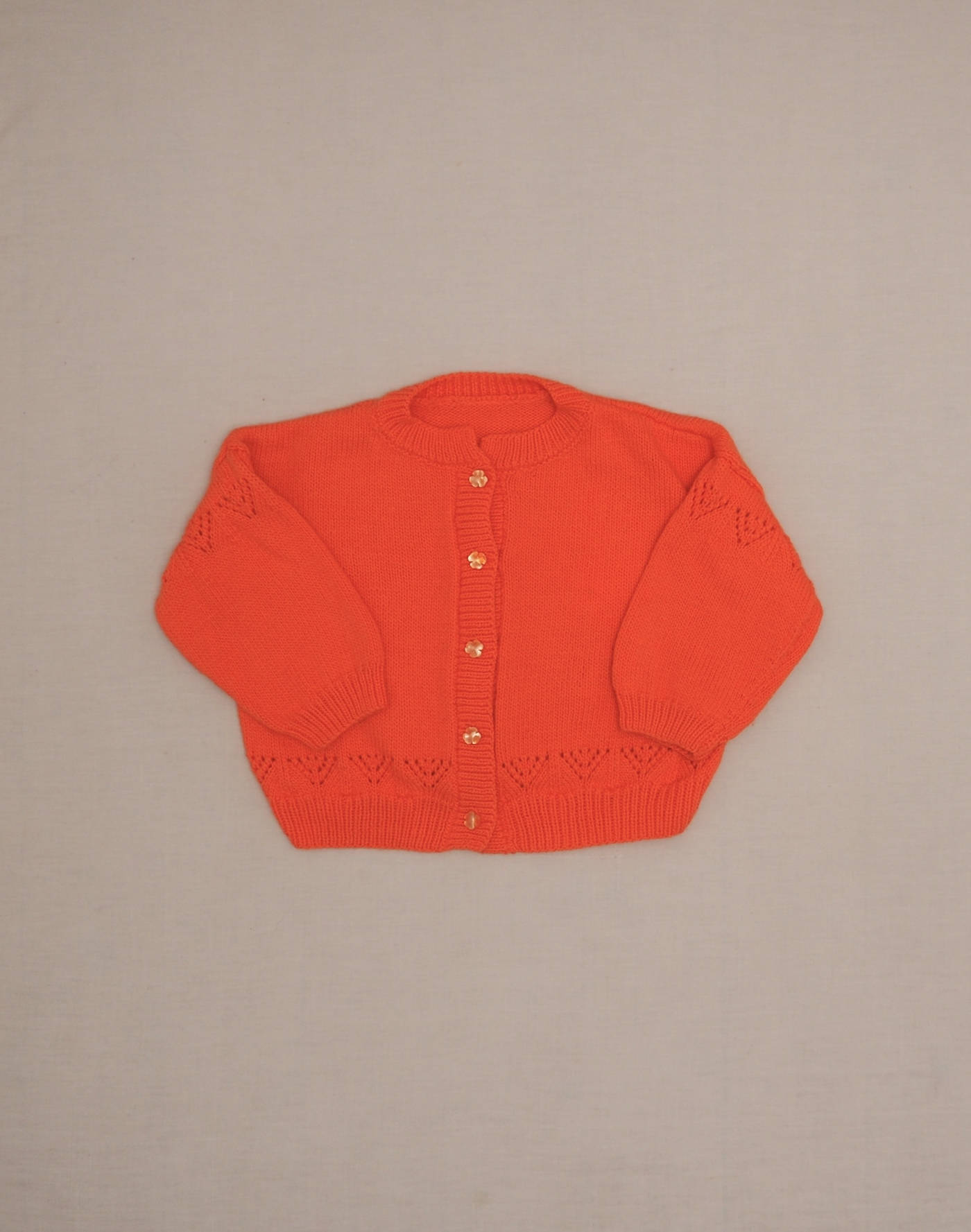 Hand-knitted coral cardigan