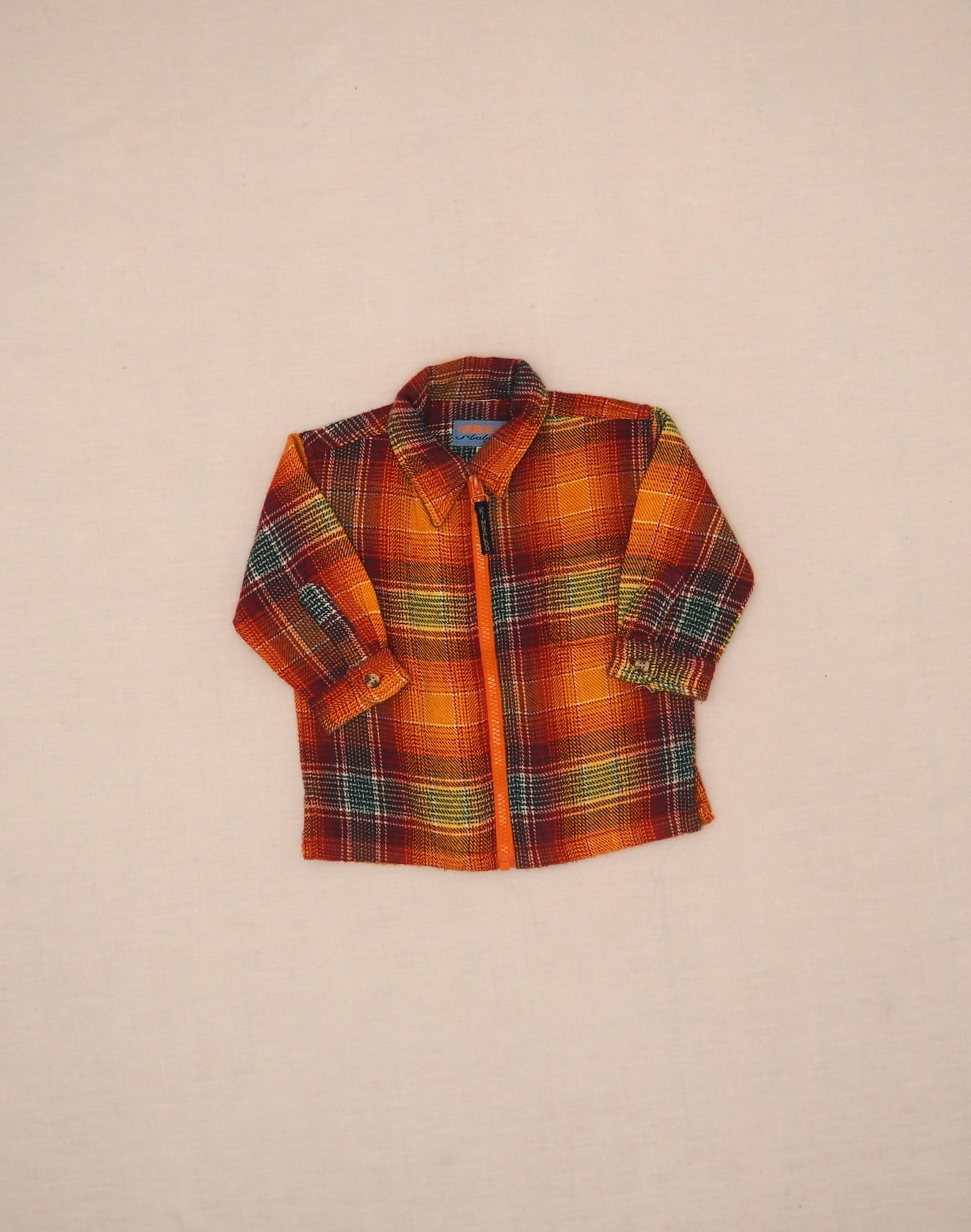 Veste à carreaux zippée