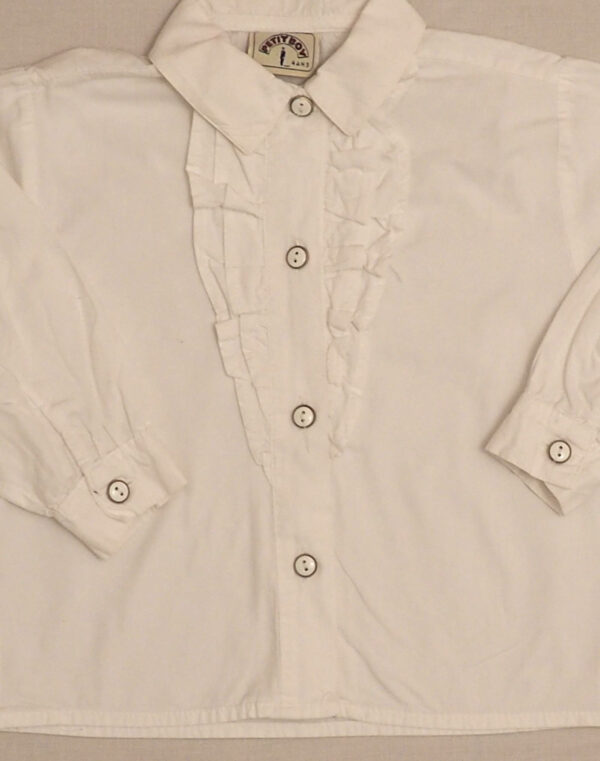 White button-down shirt with ruffle