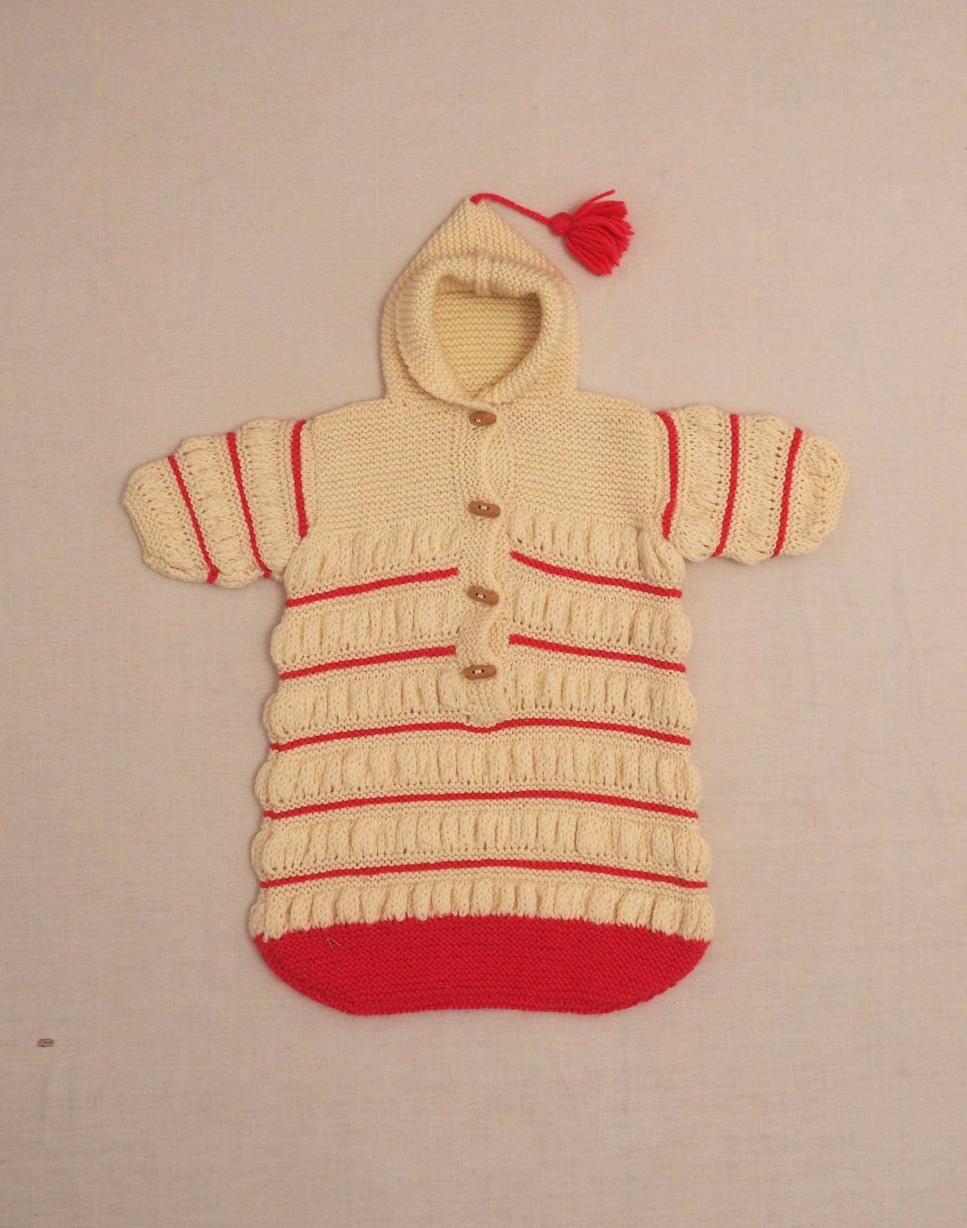 Hand-knitted baby sleeping bag