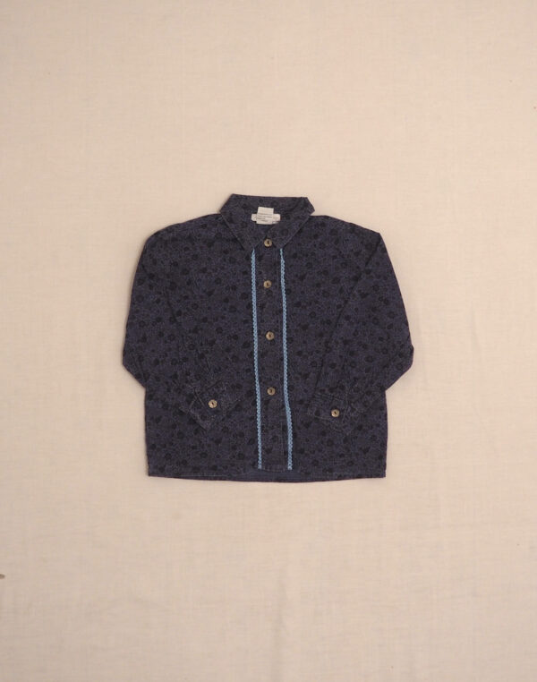 Floral shirt with crocheted buttonhole