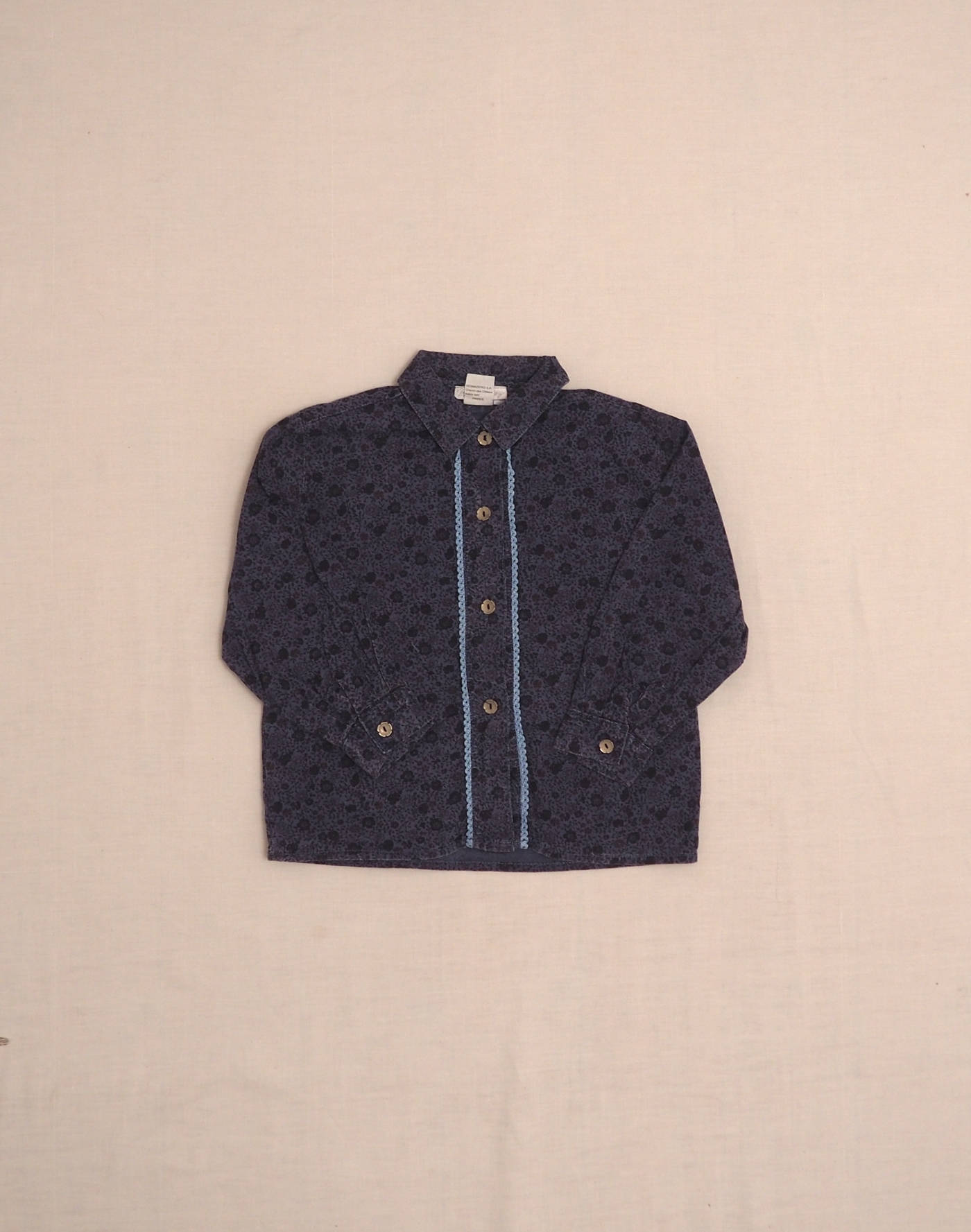 Floral shirt with crocheted buttonhole