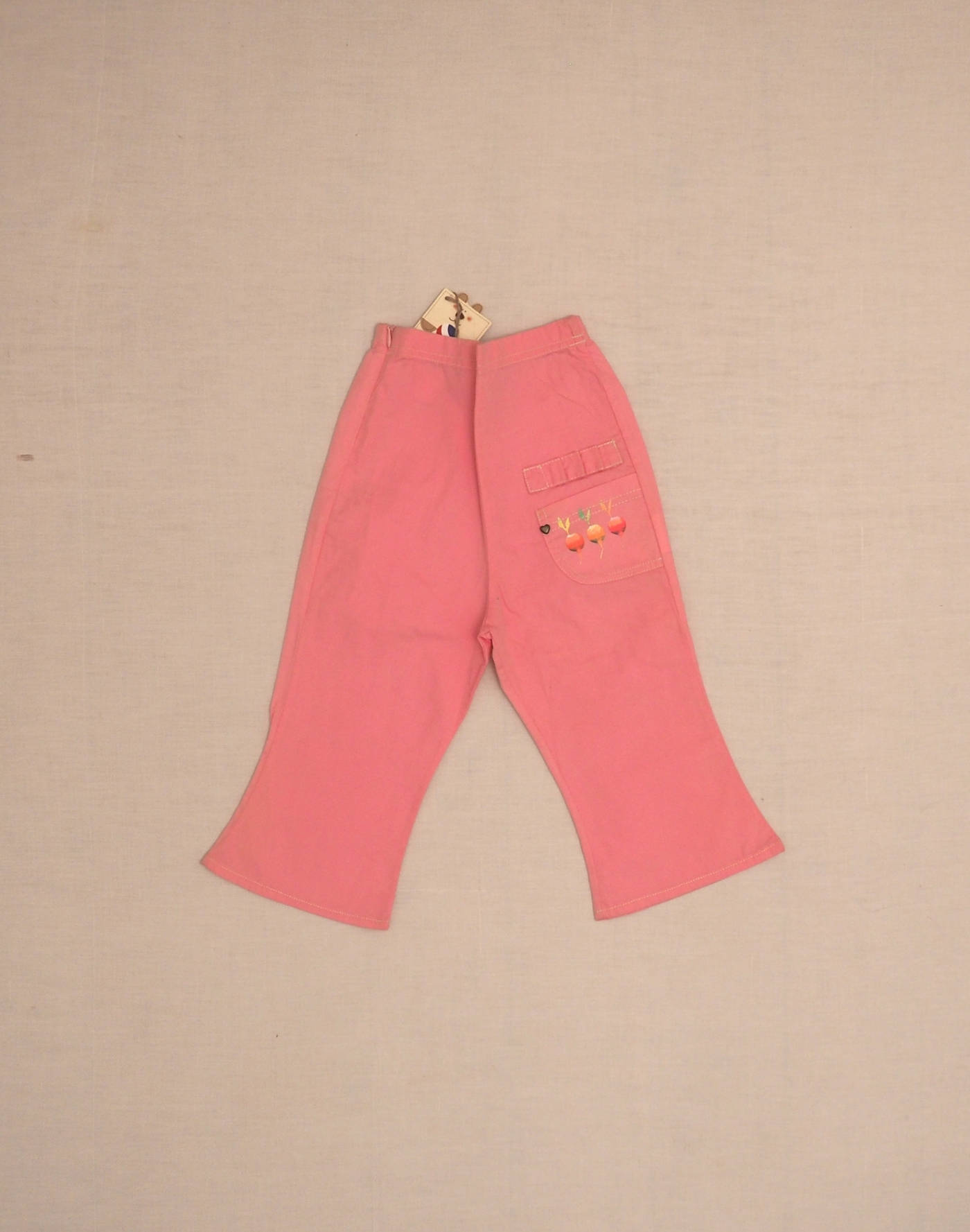 Pink pants with three radishes