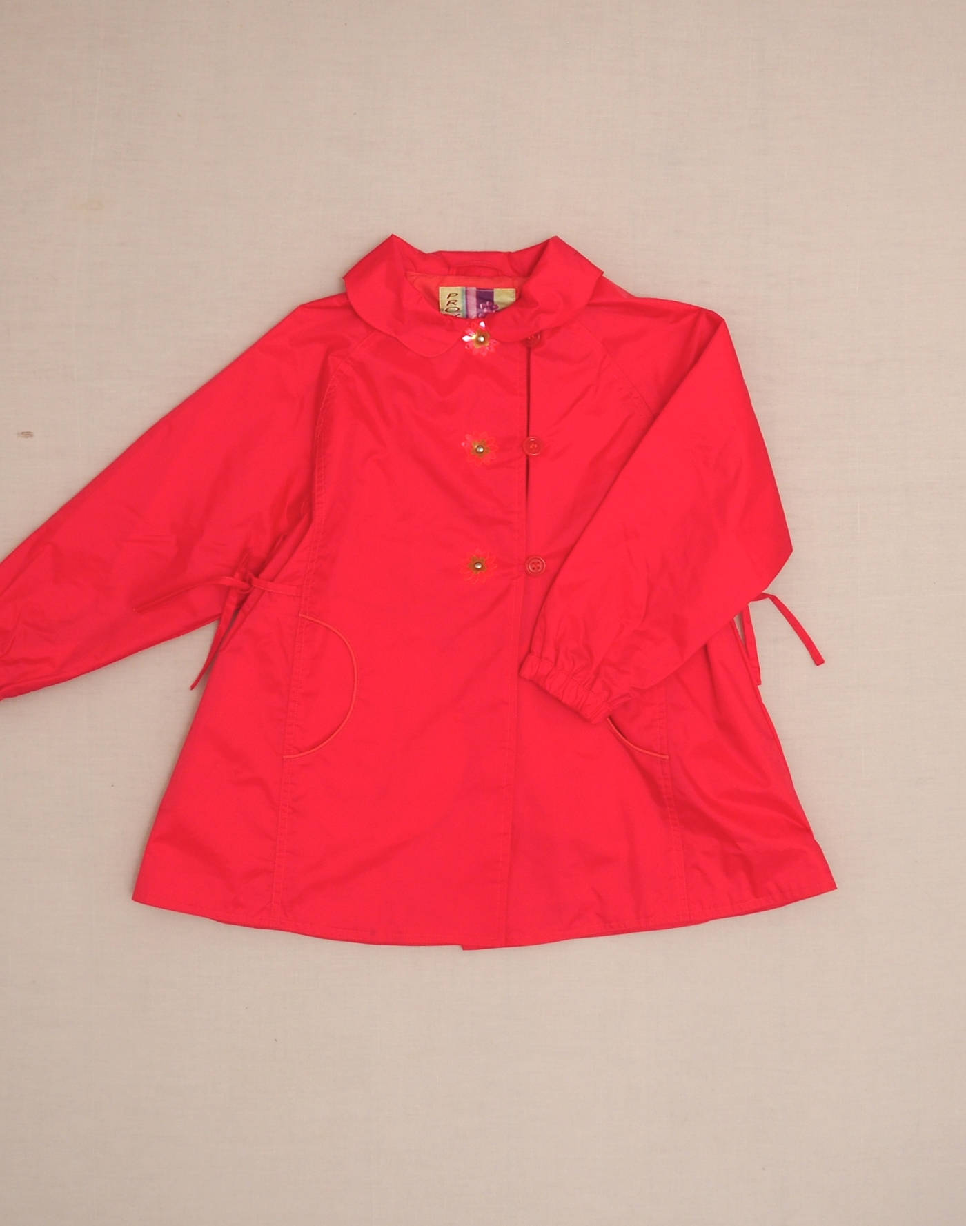 Imperméable rose à fleurs fluo 6 ans