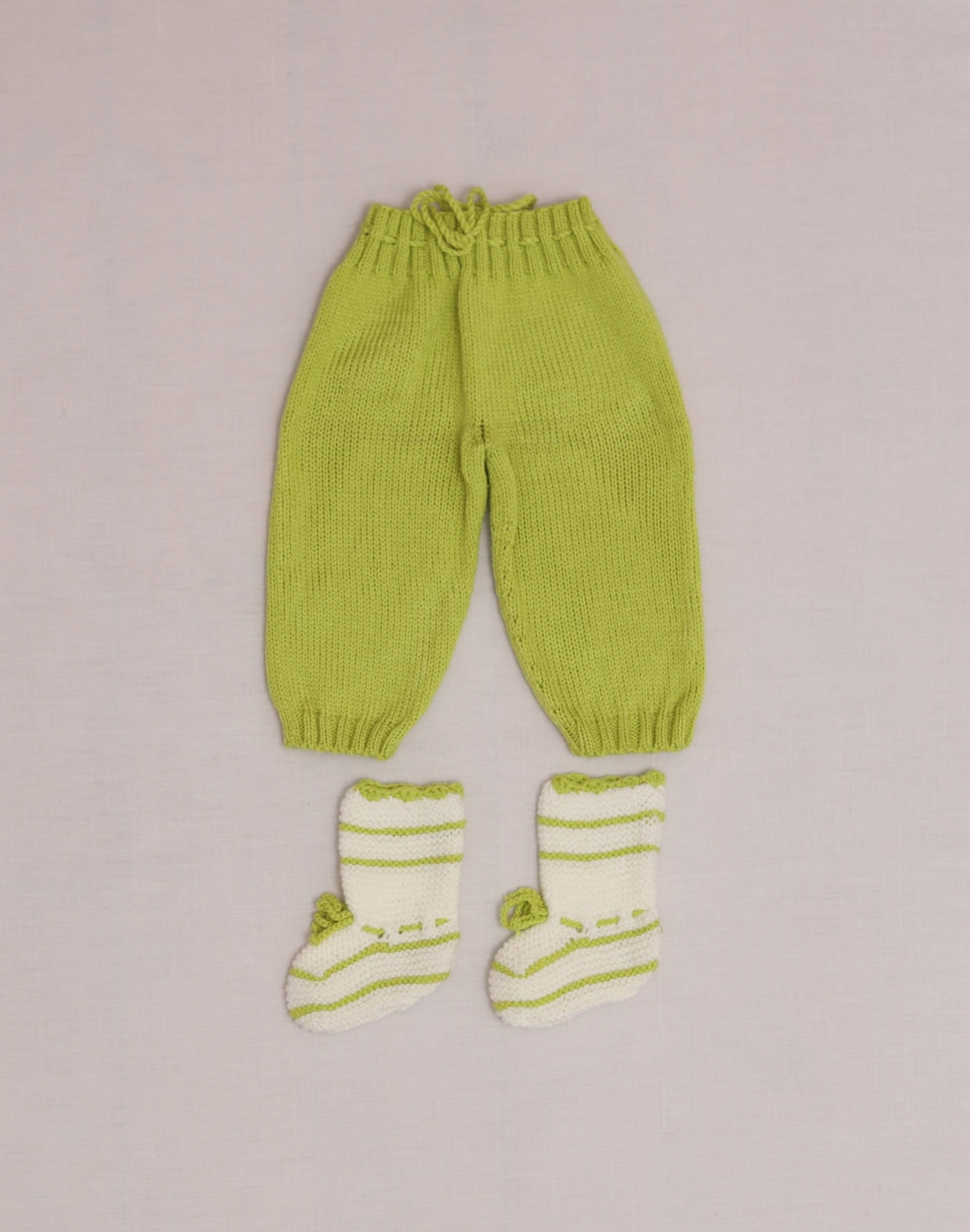 Hand-knitted pants and booties