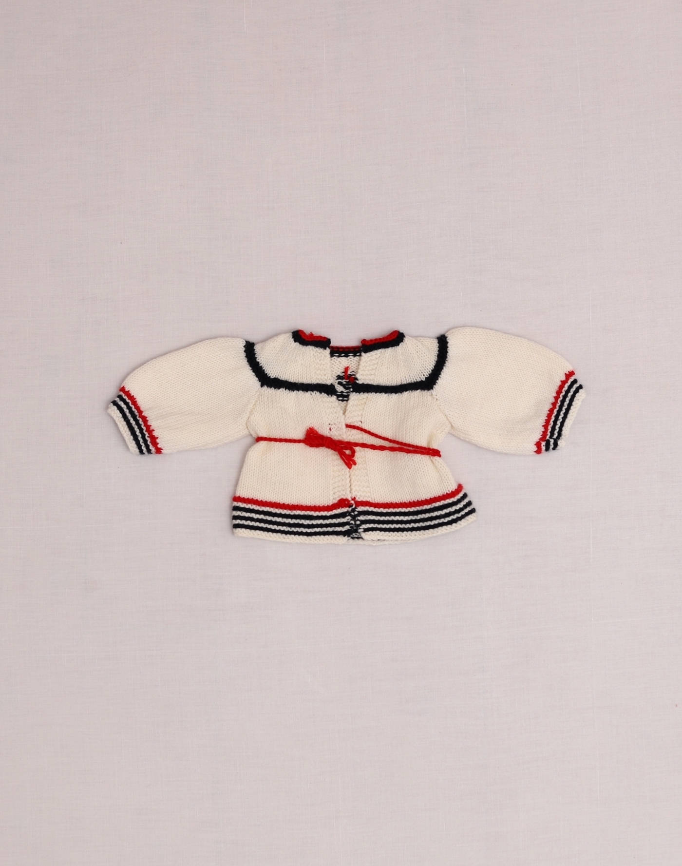 Cardigan marin tricoté main naissance