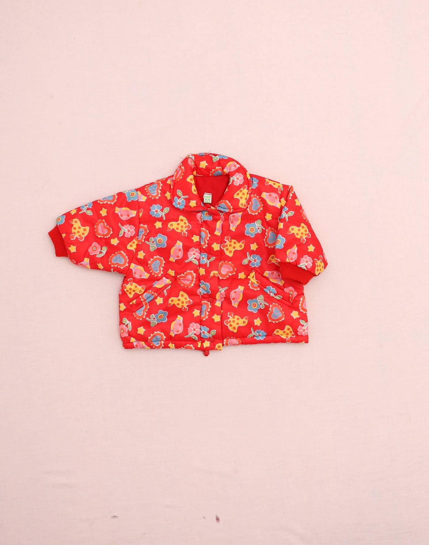 Blouson rouge à motifs 1980