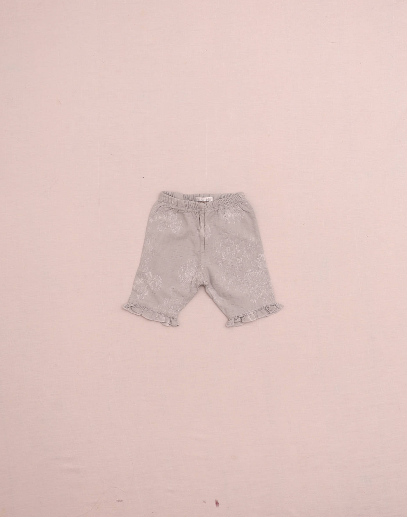Pantalon argenté doublé brodé