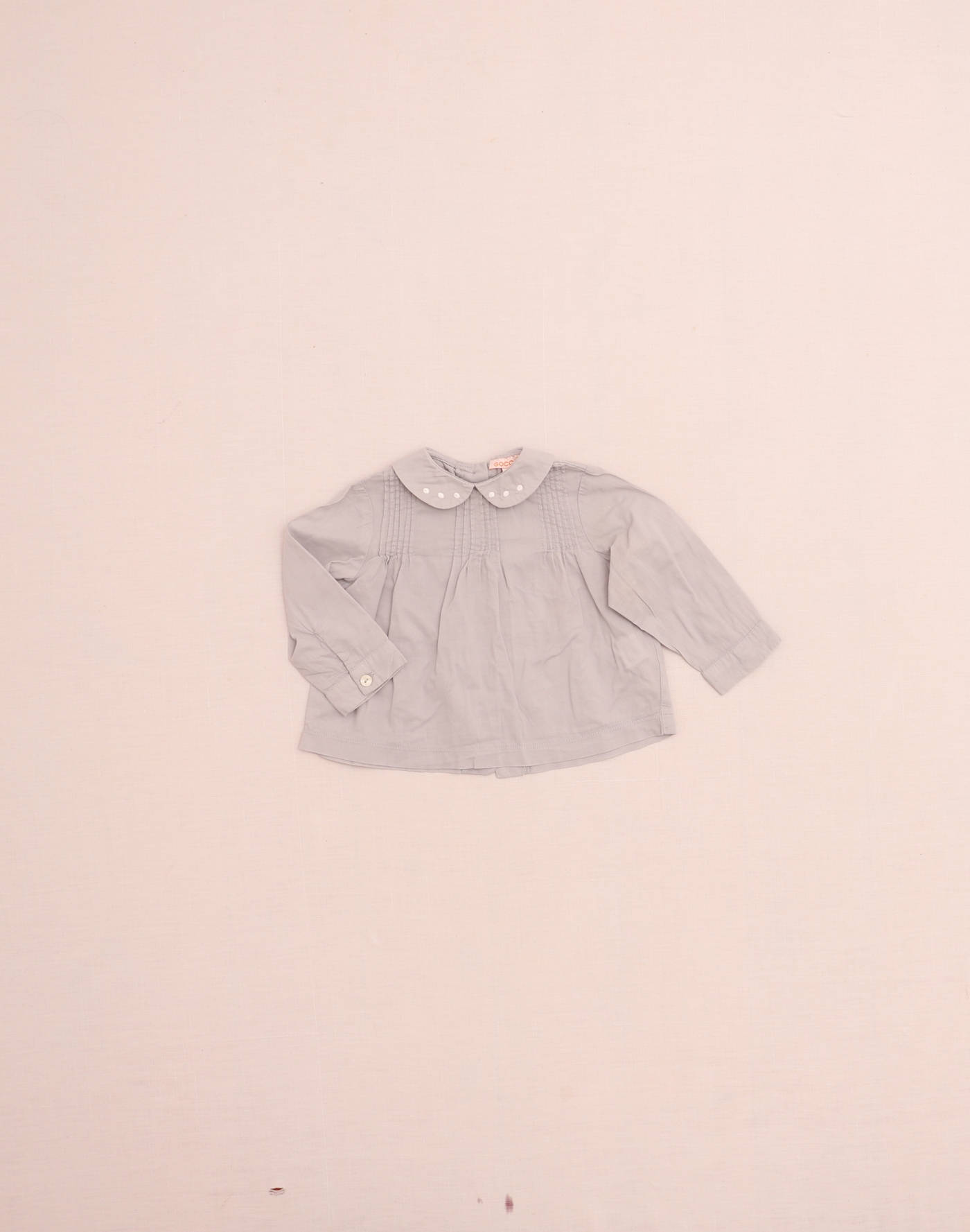 Blouse grise à plissé